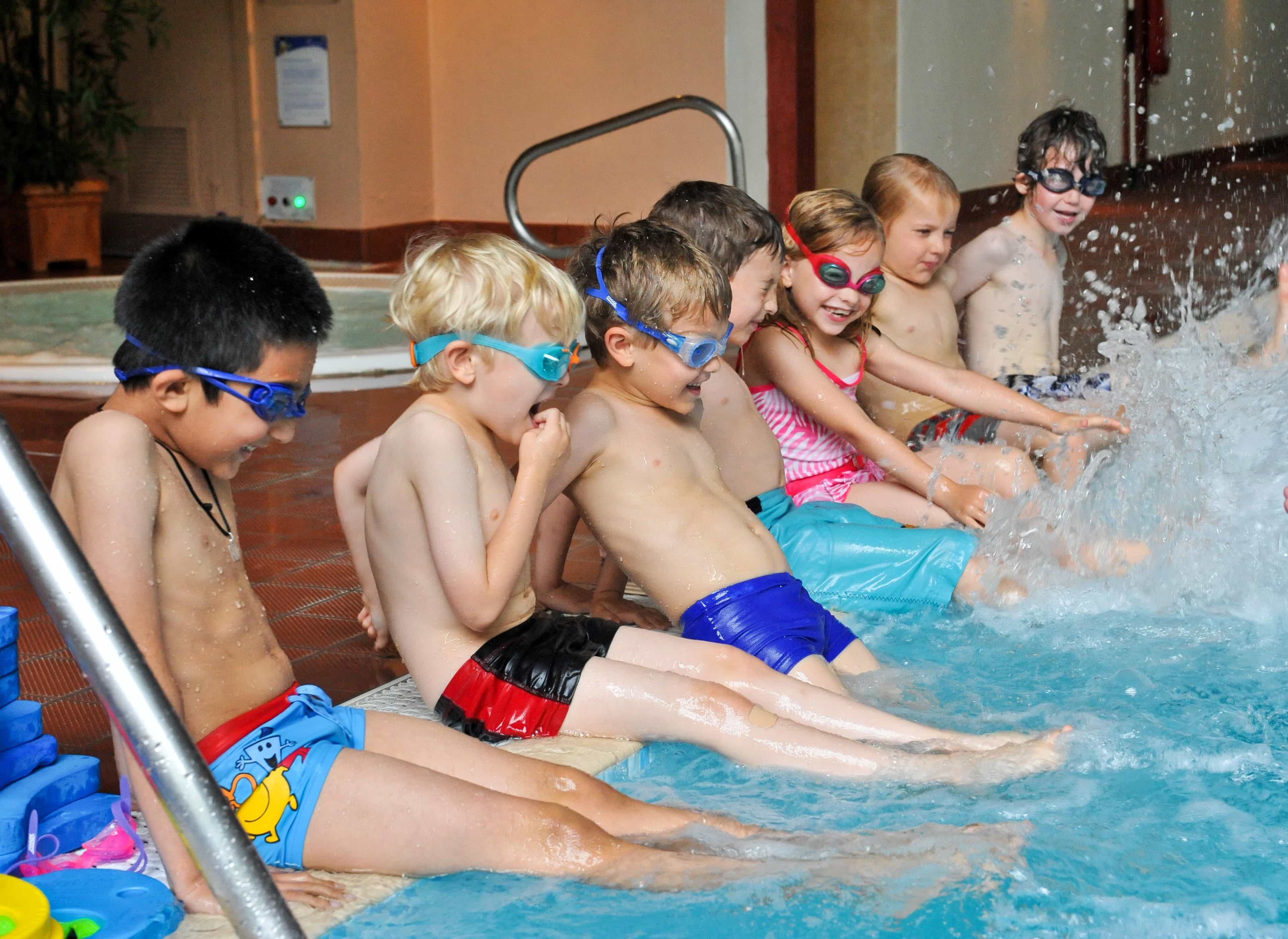 Children splashing in pool
