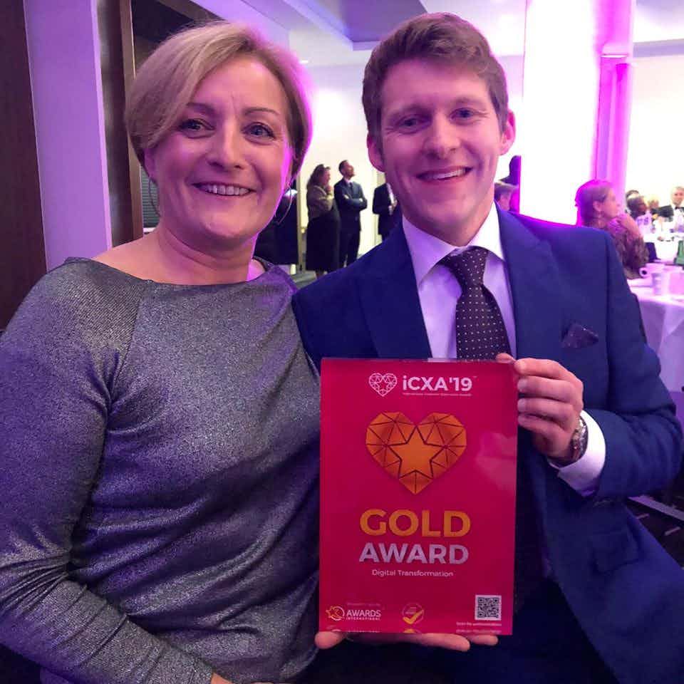 Picture of Theo Rachel holding Gold Award