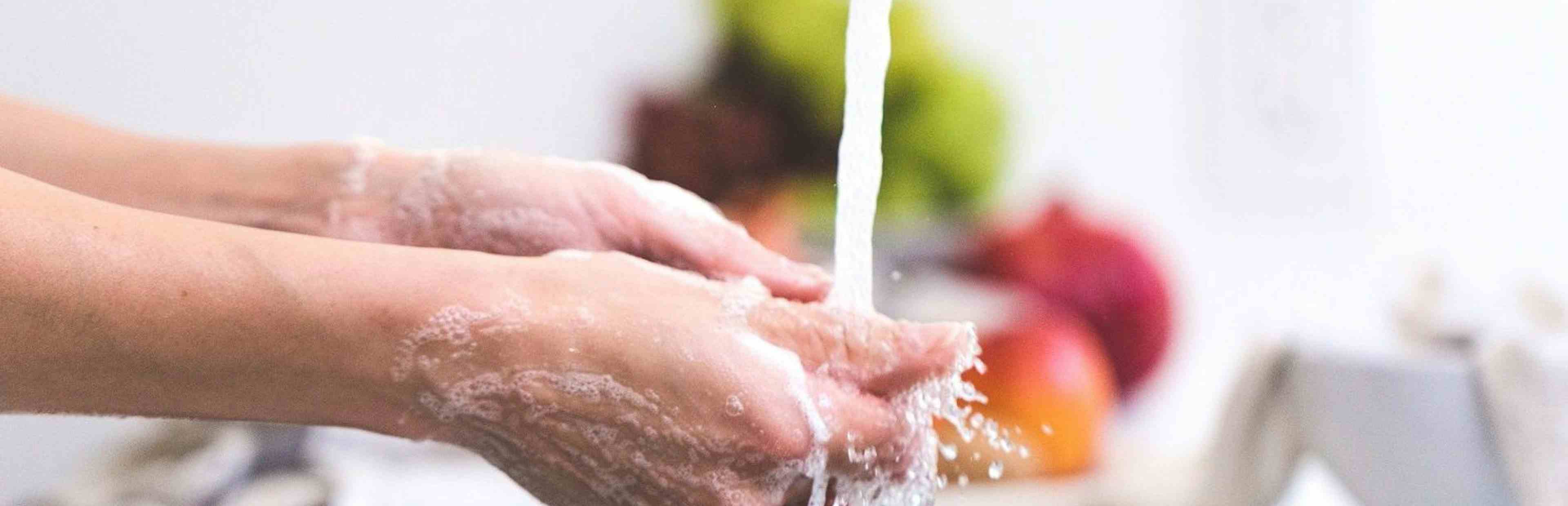Washing hands under running water