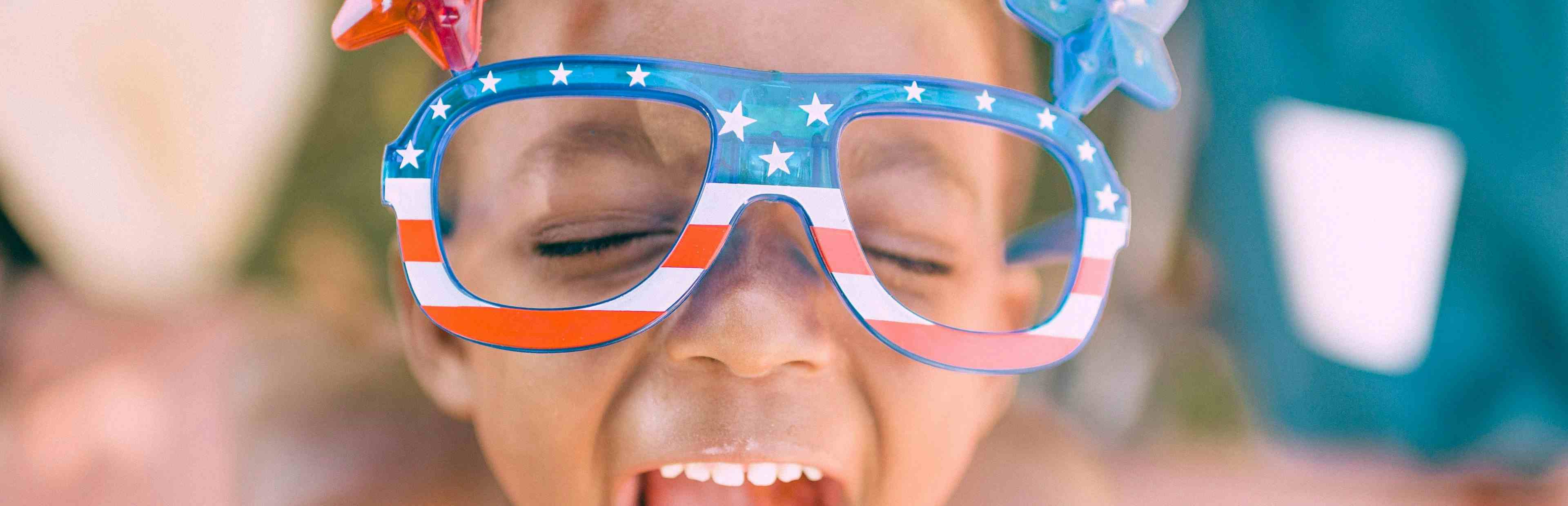 Child happy scream wearing America glasses