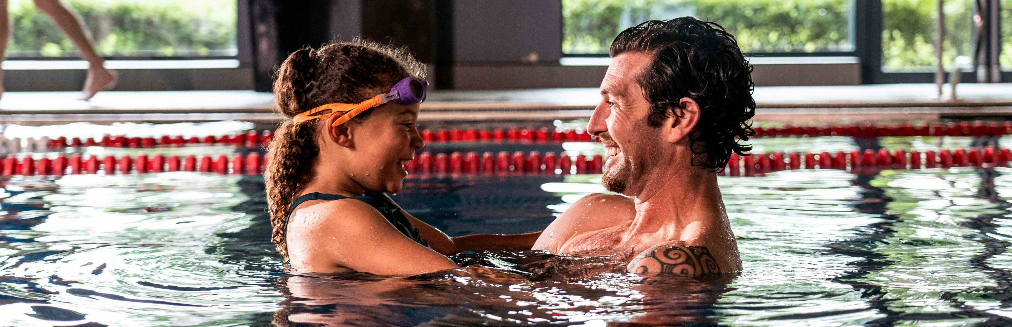 Father and Daughter swimming
