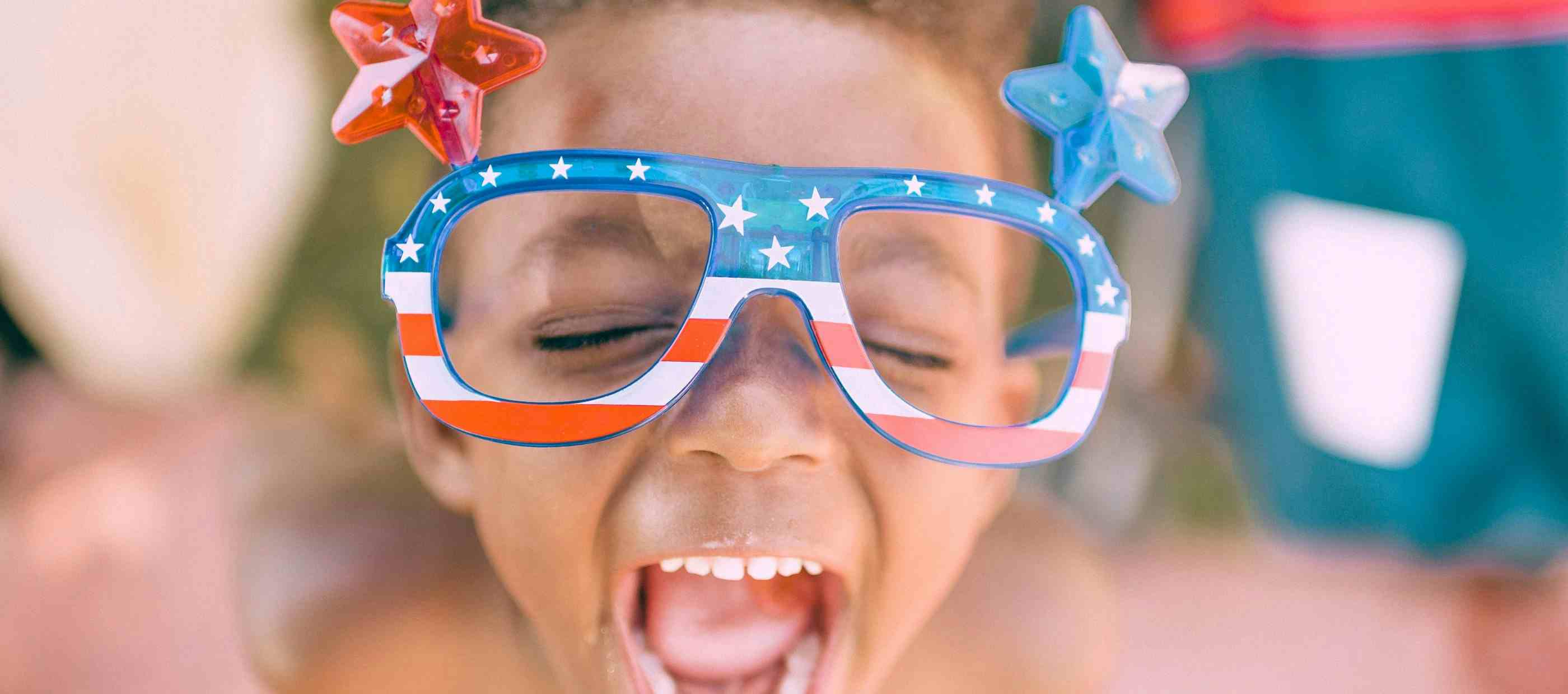 Child happy scream wearing America glasses