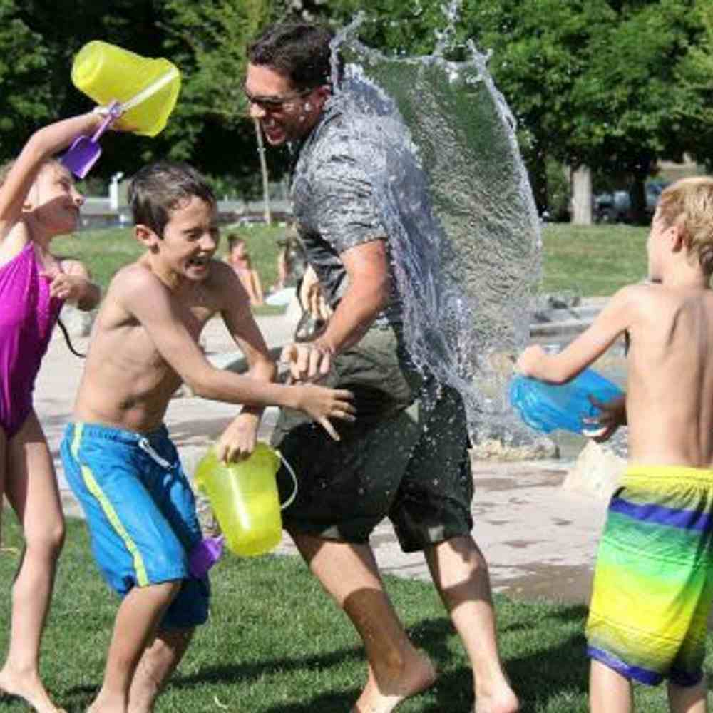 Children chucking buckets of water 