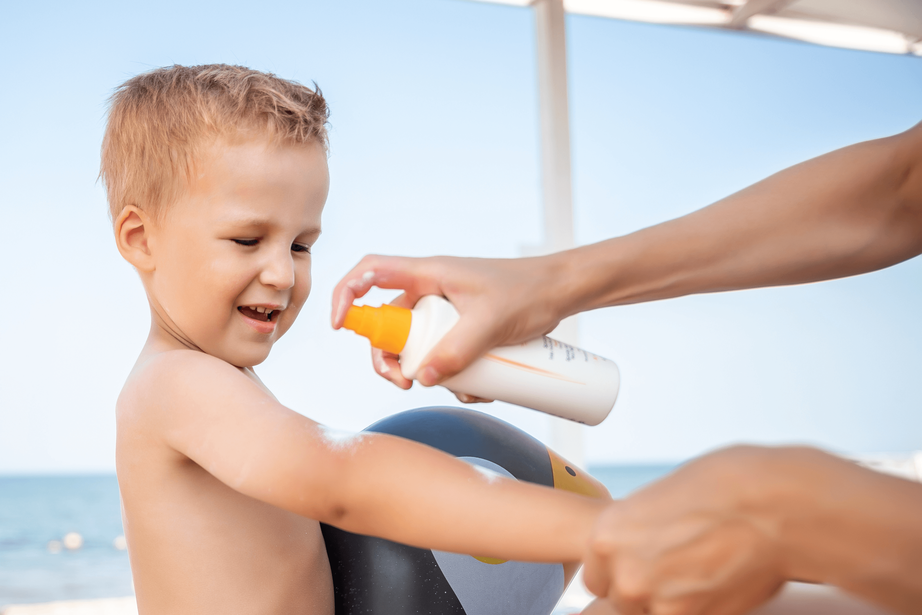 Applying suncream to child