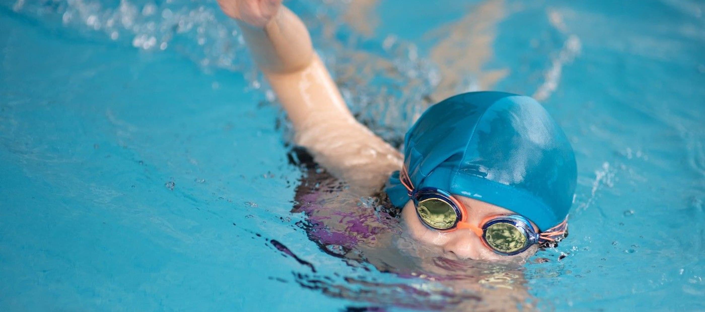 Child swimming in pool