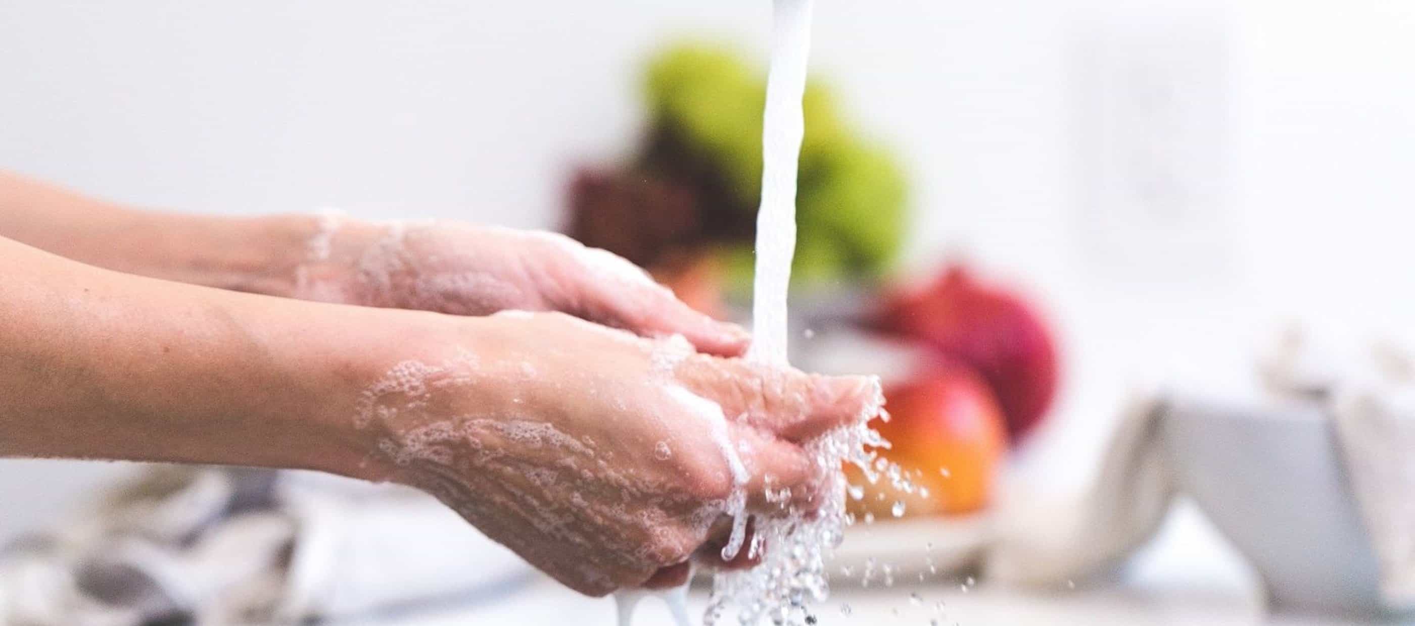 Washing hands under running water